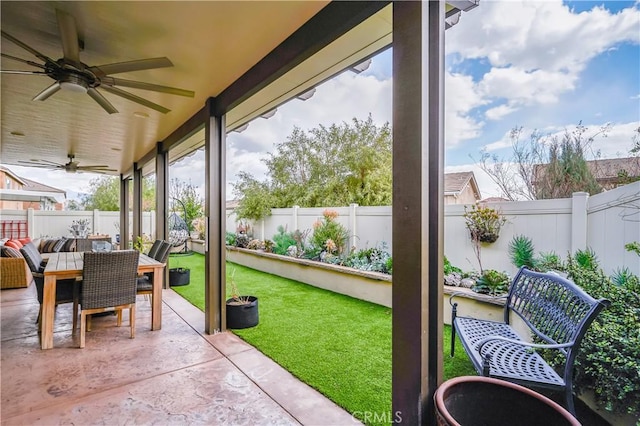 3554 Twinberry Ln, San Bernardino, CA 92407 - fenced backyard with ceiling fan, outdoor dining area, and a patio area