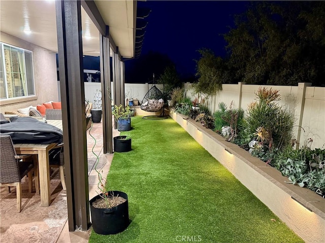 3554 Twinberry Ln, San Bernardino, CA 92407 - yard at twilight featuring a fenced backyard
