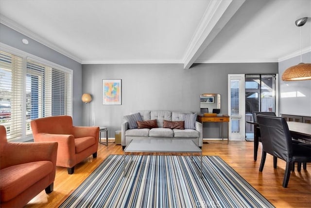 living room with ornamental molding and light wood-type flooring