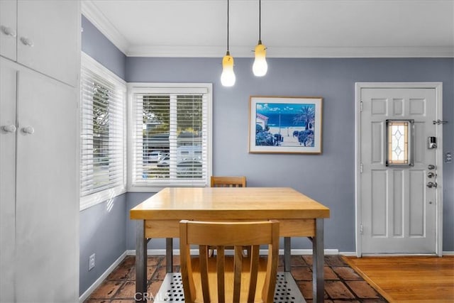 dining room featuring crown molding and hardwood / wood-style flooring