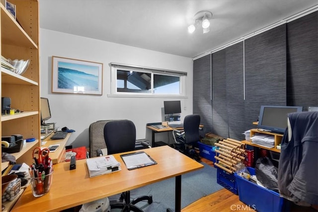 office area with light hardwood / wood-style flooring