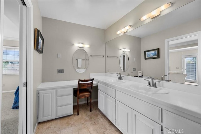 bathroom with tile patterned floors and vanity