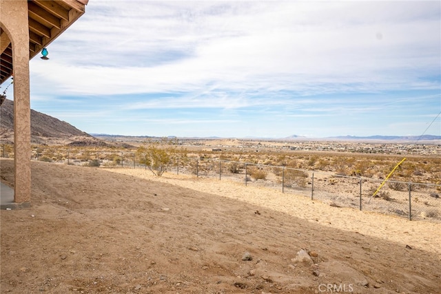 view of mountain feature featuring a rural view and view of desert