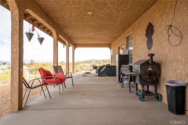 74384 Rocky Rd Unit 29, Palms, CA 92277 - view of patio featuring an outdoor living space and area for grilling