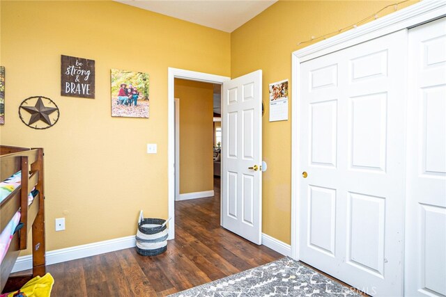 74384 Rocky Rd Unit 29, Palms, CA 92277 - bedroom with wood finished floors, baseboards, and a closet