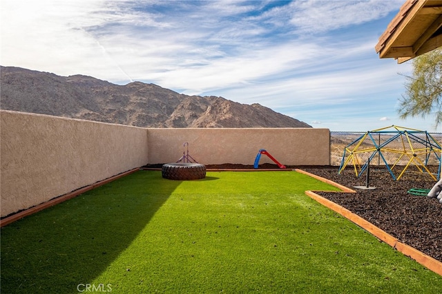 74384 Rocky Rd Unit 29, Palms, CA 92277 - view of yard with a playground and a mountain view
