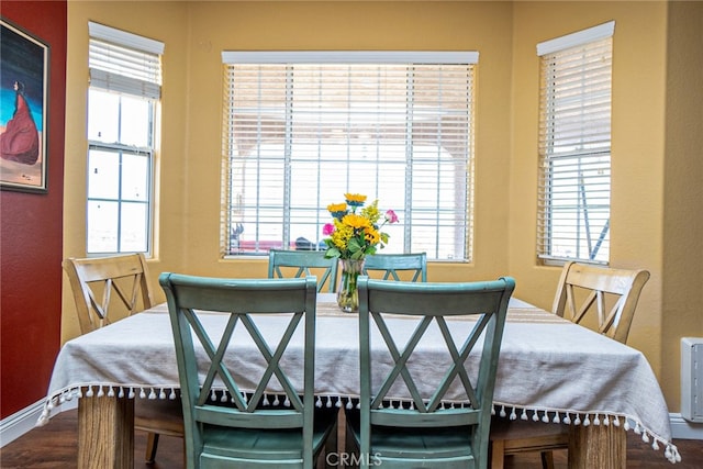 dining area featuring a wealth of natural light and baseboards