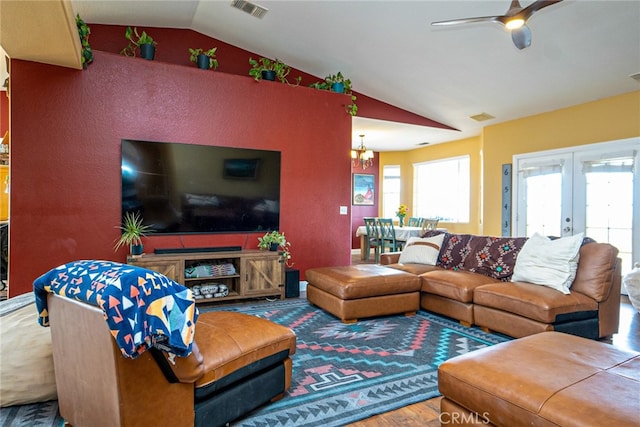 74384 Rocky Rd Unit 29, Palms, CA 92277 - living room with lofted ceiling, wood finished floors, ceiling fan, french doors, and a chandelier