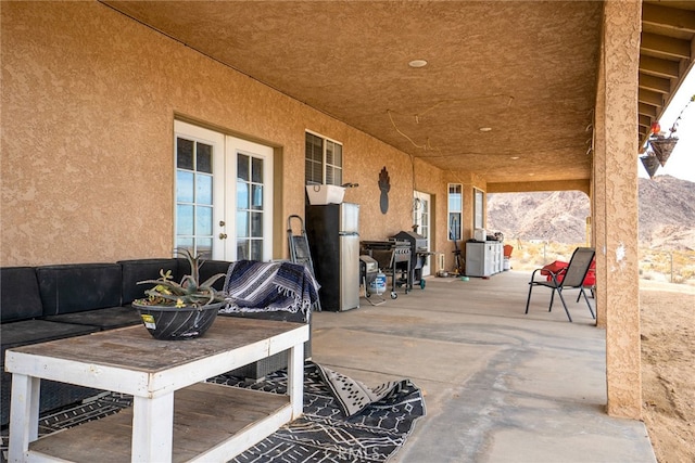 view of patio / terrace featuring area for grilling and french doors