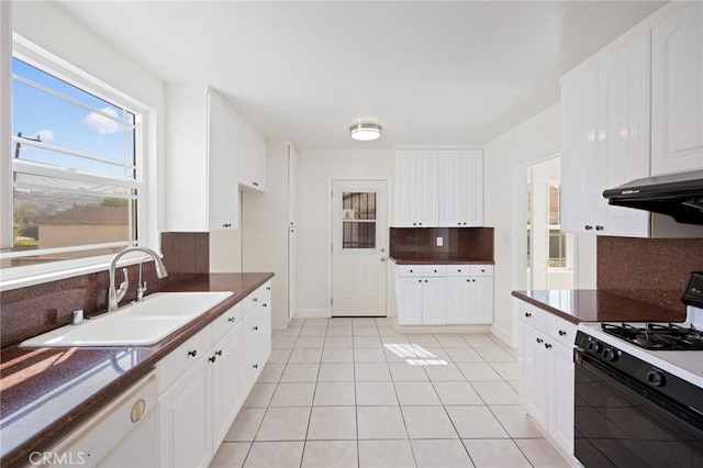 kitchen with light tile patterned flooring, sink, range with gas stovetop, dishwasher, and white cabinets