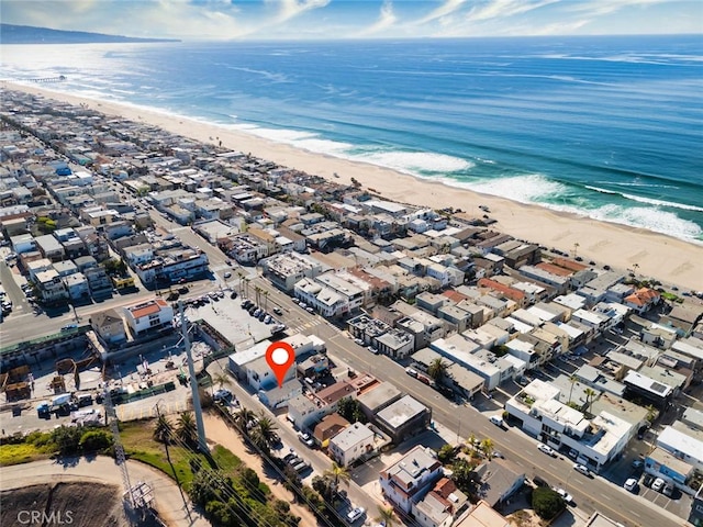 aerial view featuring a water view and a beach view