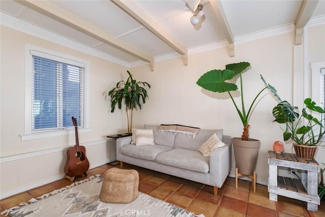 sitting room with beamed ceiling, ornamental molding, and tile patterned flooring