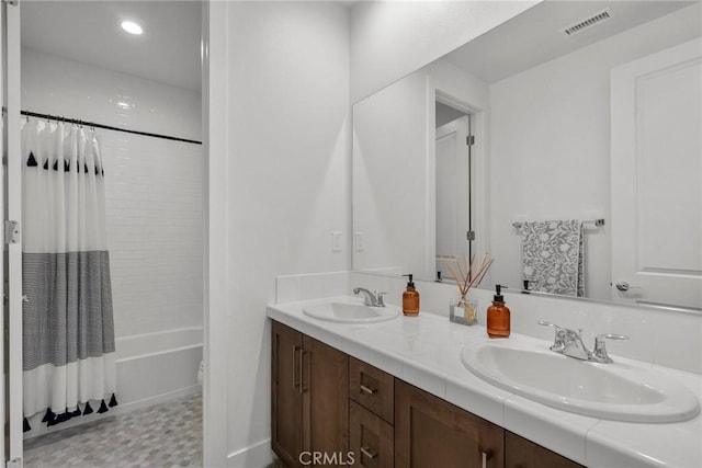 full bathroom featuring toilet, vanity, and shower / bathtub combination with curtain