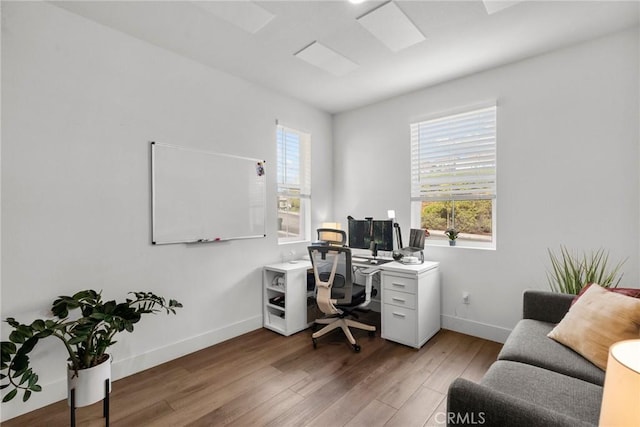 office featuring wood-type flooring and plenty of natural light