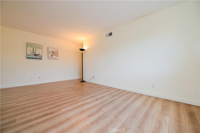 unfurnished room featuring light wood-type flooring