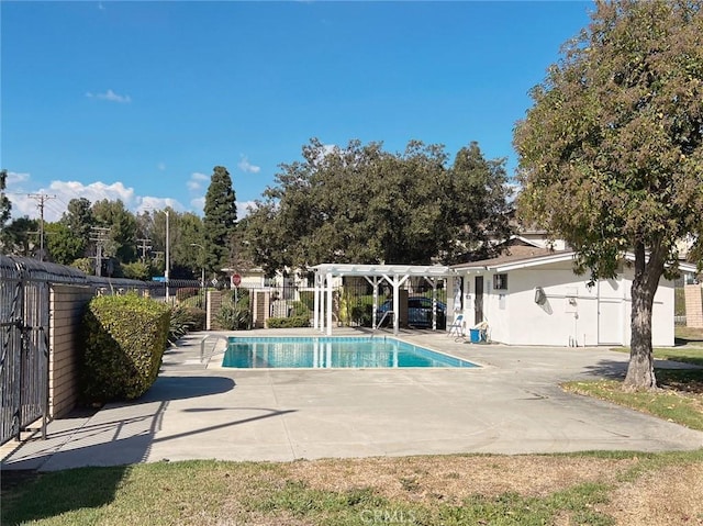 view of swimming pool featuring a pergola and a patio