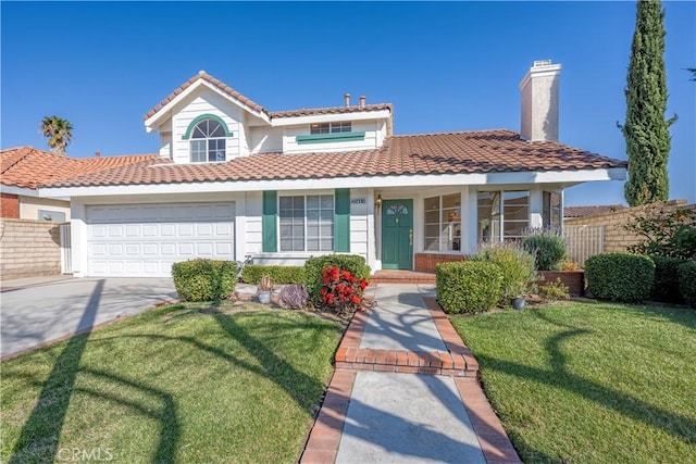 view of front of house with a garage and a front yard