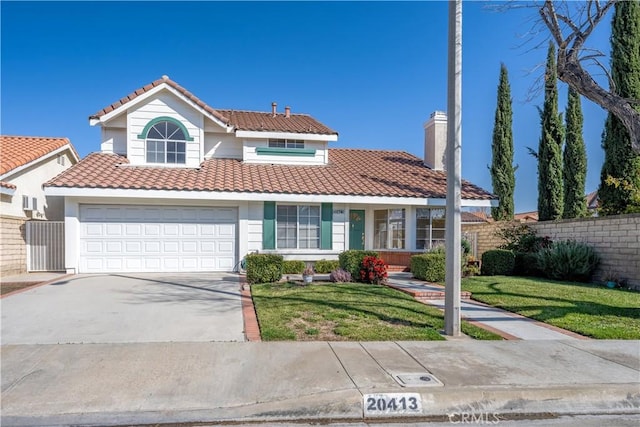 view of front of house with a garage and a front yard