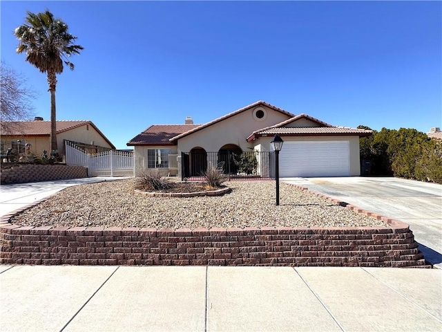 ranch-style house with a tile roof, driveway, fence, a garage, and stucco siding