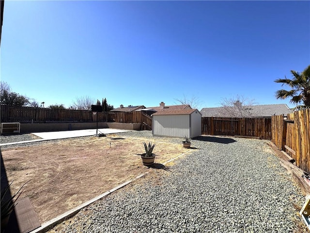 view of yard with a patio area and a storage unit