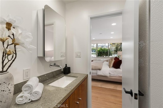 bathroom featuring vanity and wood-type flooring