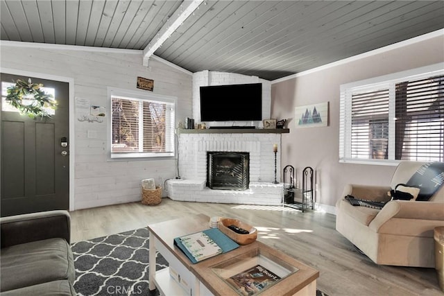 living room with vaulted ceiling with beams, a brick fireplace, wooden ceiling, wooden walls, and hardwood / wood-style floors