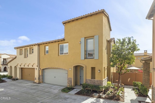 mediterranean / spanish home with a garage