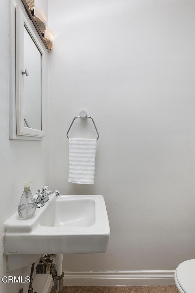 bathroom with sink and toilet