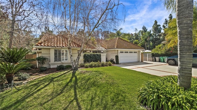 mediterranean / spanish house featuring an attached garage, concrete driveway, a tiled roof, stucco siding, and a front yard