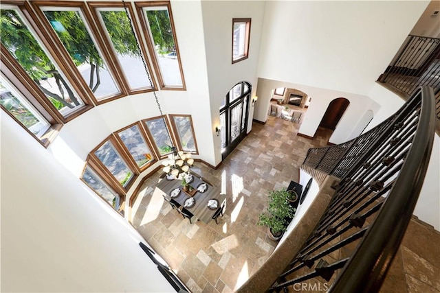 living room featuring a towering ceiling