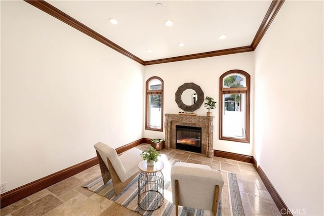 living room featuring crown molding and a high end fireplace