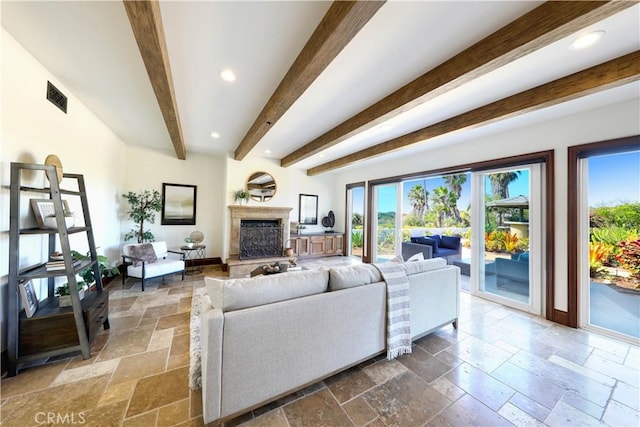 living room featuring beam ceiling