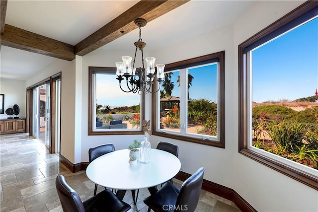 dining area featuring an inviting chandelier and beam ceiling