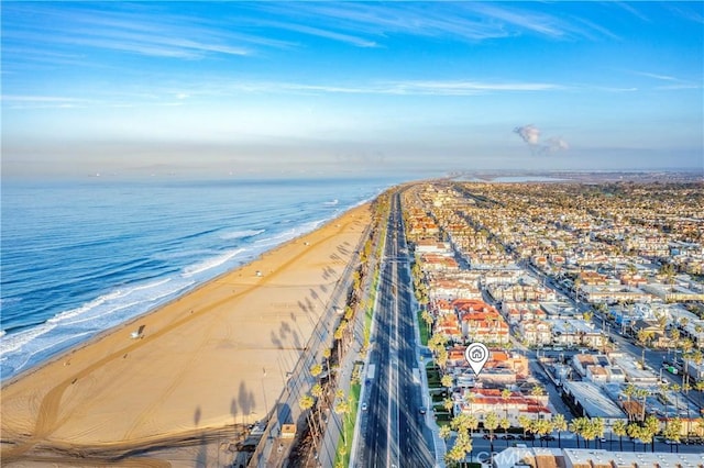 view of home's community featuring a view of the beach and a water view