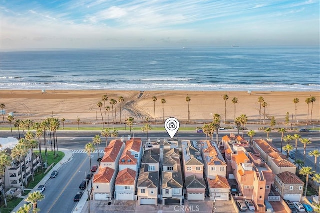 bird's eye view featuring a view of the beach and a water view