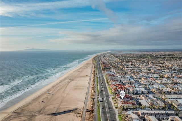 aerial view featuring a water view and a beach view