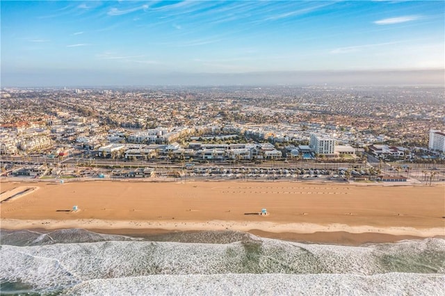 bird's eye view featuring a water view and a view of the beach