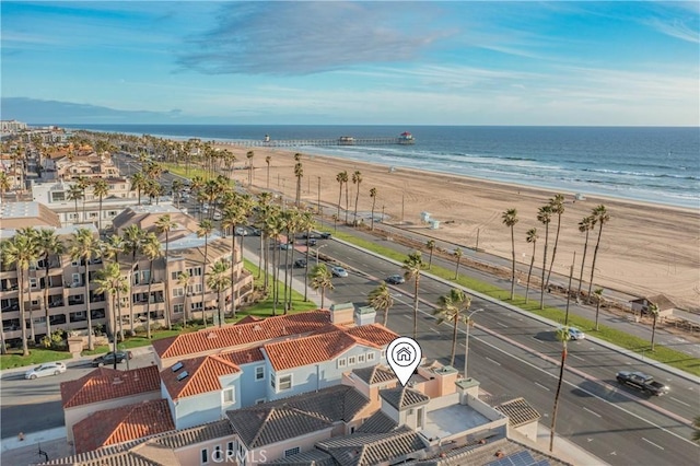 birds eye view of property with a view of the beach and a water view