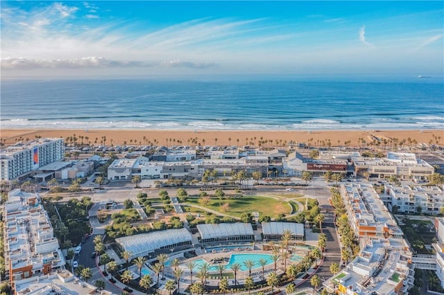 drone / aerial view with a beach view and a water view