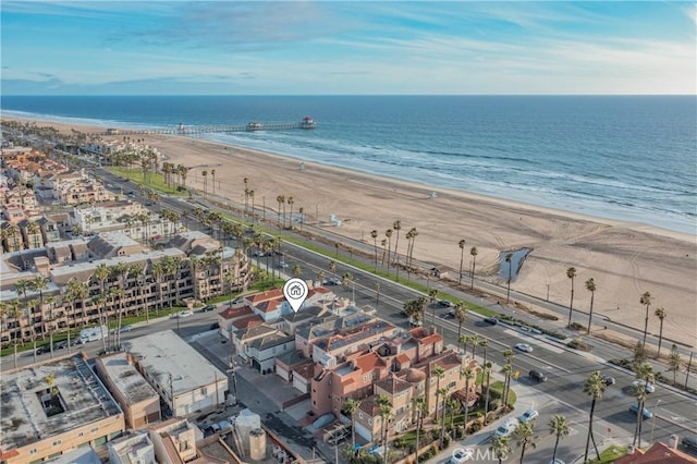 birds eye view of property with a view of the beach and a water view