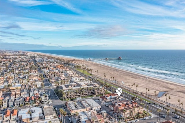 aerial view with a water view and a view of the beach