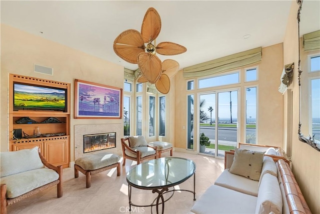 sitting room featuring ceiling fan