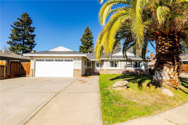 ranch-style house with a garage and a front yard