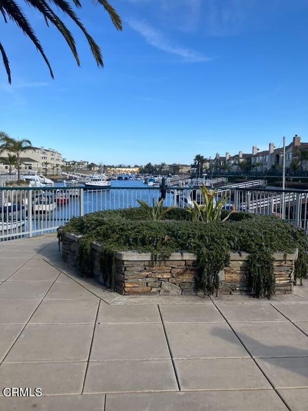 view of patio featuring a water view