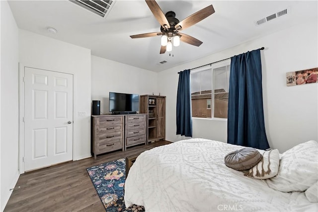 bedroom featuring dark hardwood / wood-style floors and ceiling fan