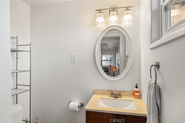 bathroom with vanity and toilet