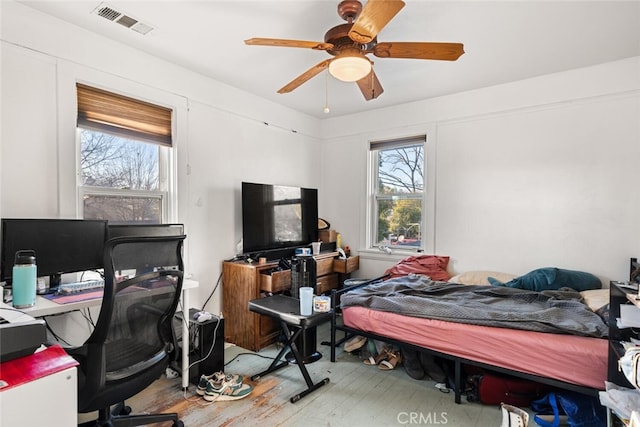 bedroom featuring ceiling fan and wood-type flooring