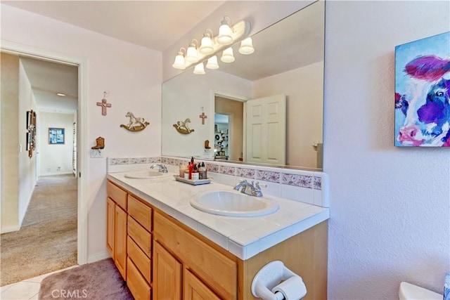 full bathroom featuring a sink and double vanity