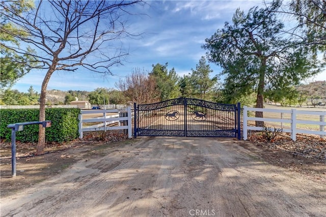 view of gate featuring fence