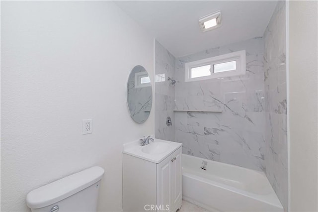 full bathroom with tiled shower / bath combo, vanity, and toilet